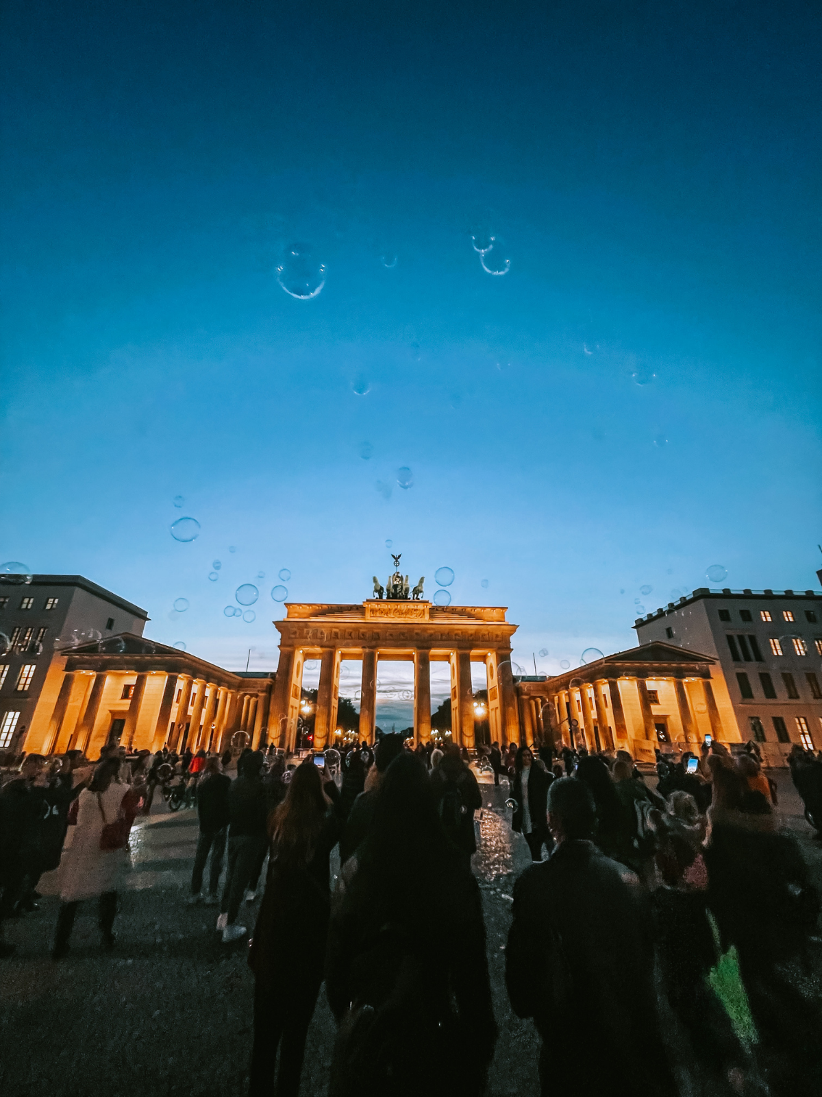The Brandenburg Gate lit up at night in Berlin.