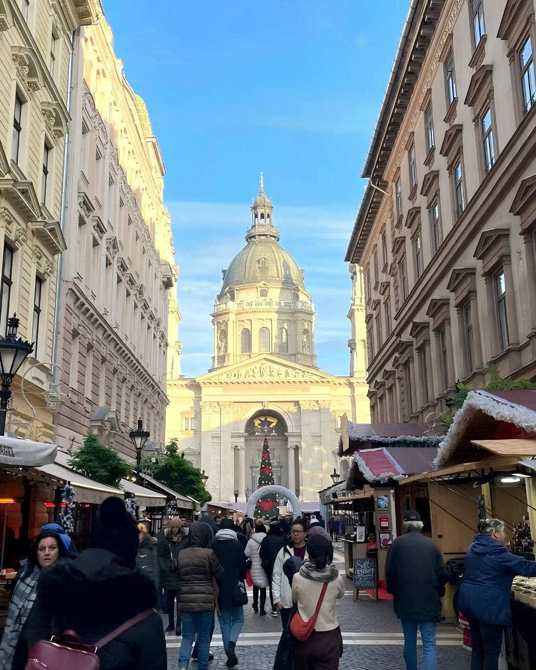 Christmas market stalls leading to St. Stephen’s Basilica in Budapest