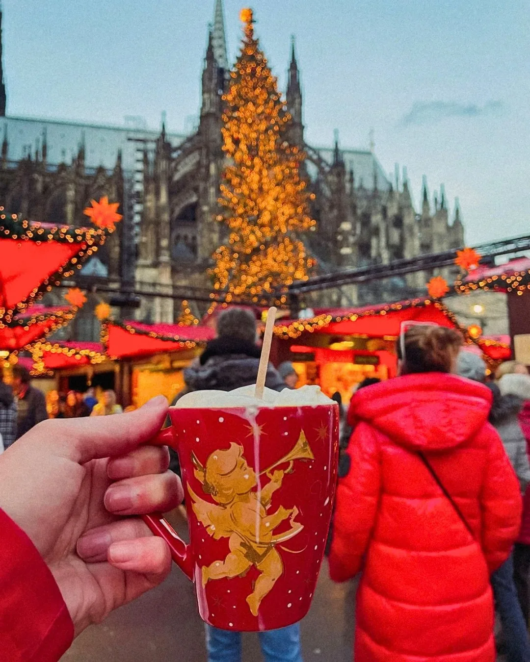 Hot chocolate in a red angel mug at the Cologne Cathedral Christmas market